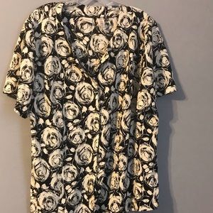 Button down blouse. Black w/ white design.